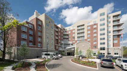 Seniors residence building with a landscaped entrance drive